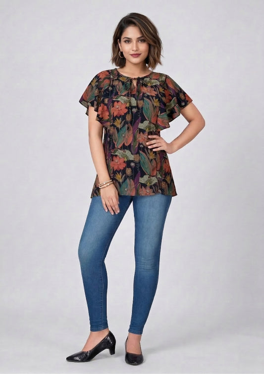 Woman wearing a patterned top and blue jeans on a white background