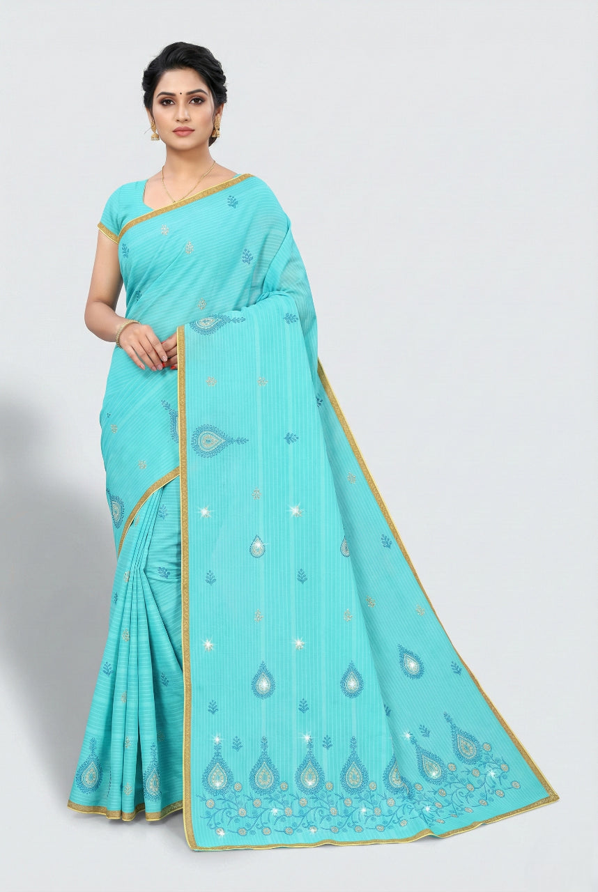Woman wearing a turquoise saree with gold border on a white background