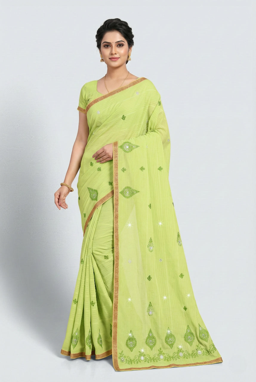 Woman wearing a light green saree with a white background