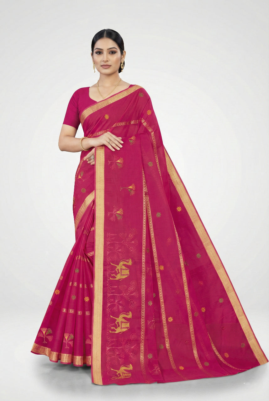 Woman wearing a pink saree with gold patterns on a white background