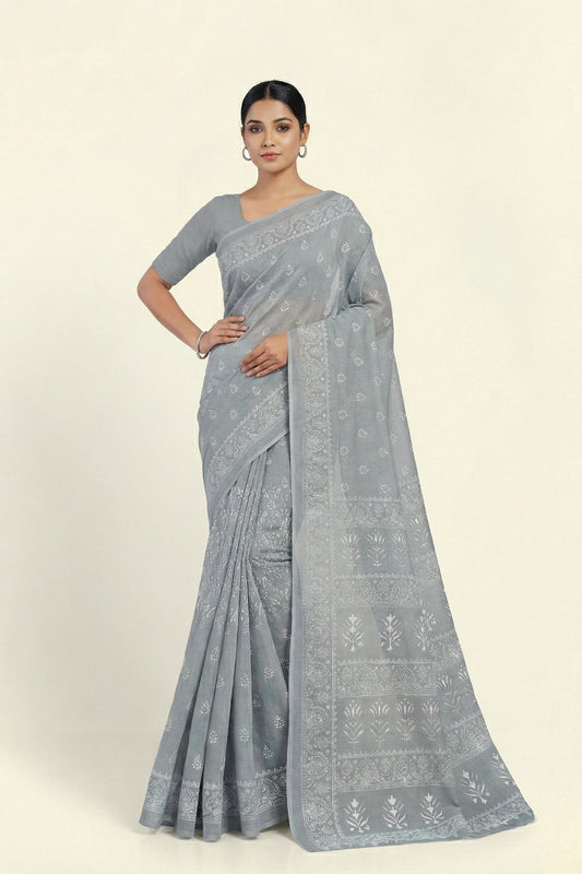 Woman wearing a gray saree with a white background