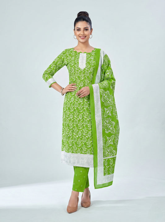 Woman wearing a green and white traditional outfit with a plain background